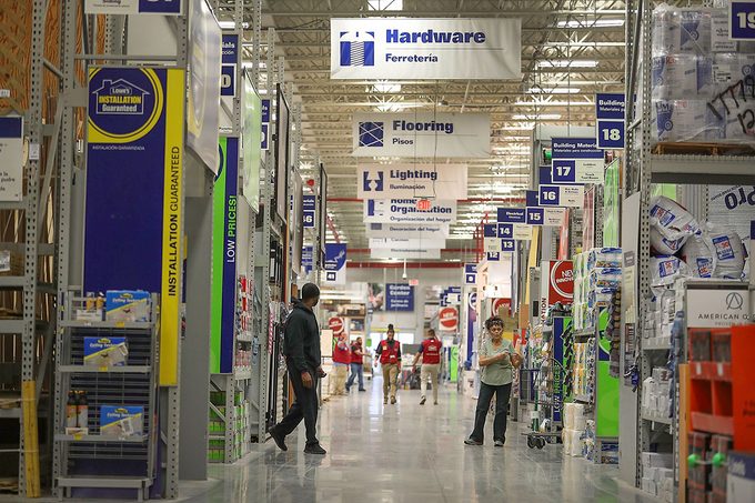 People shop at a Lowe's store