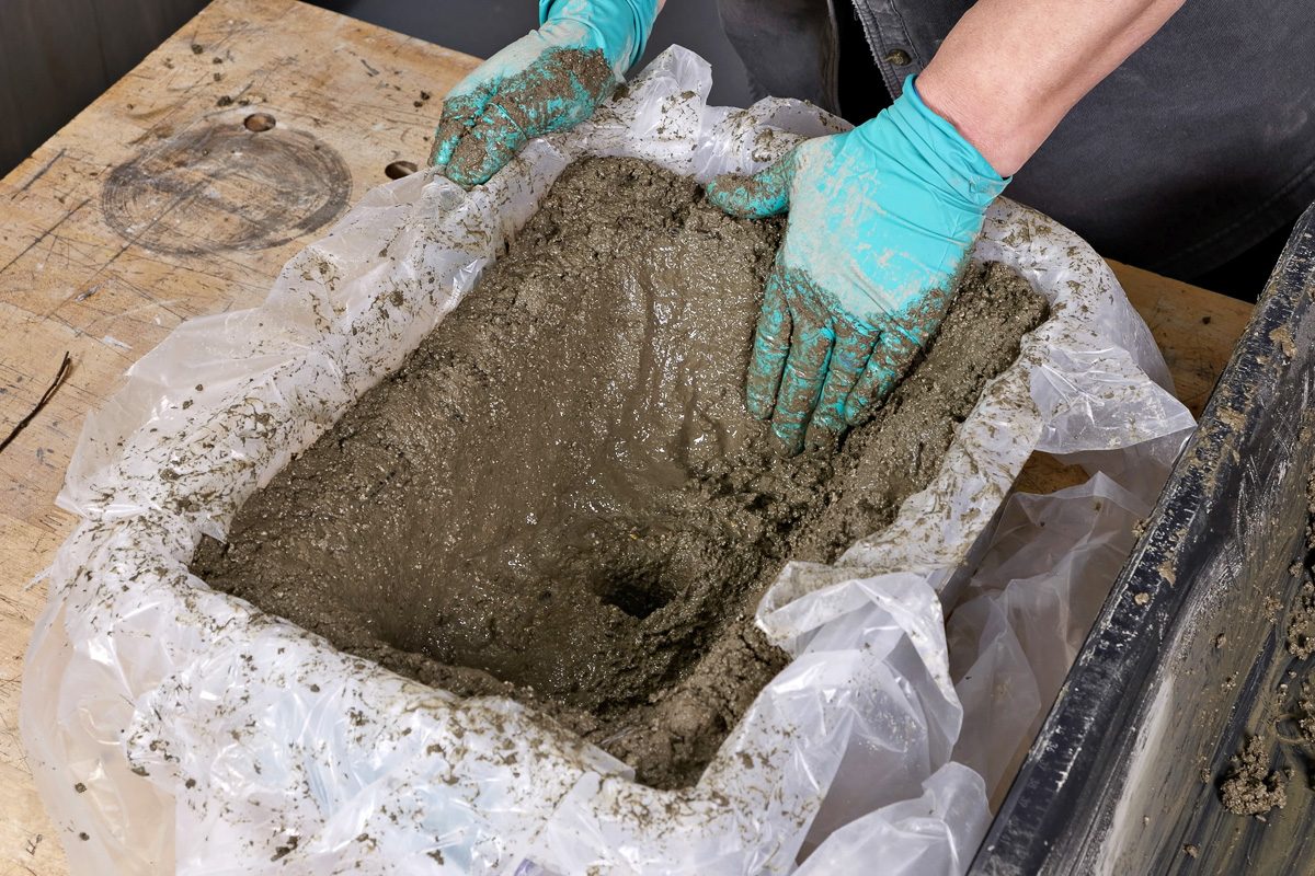 adding finishing touches to the wet hypertufa mix