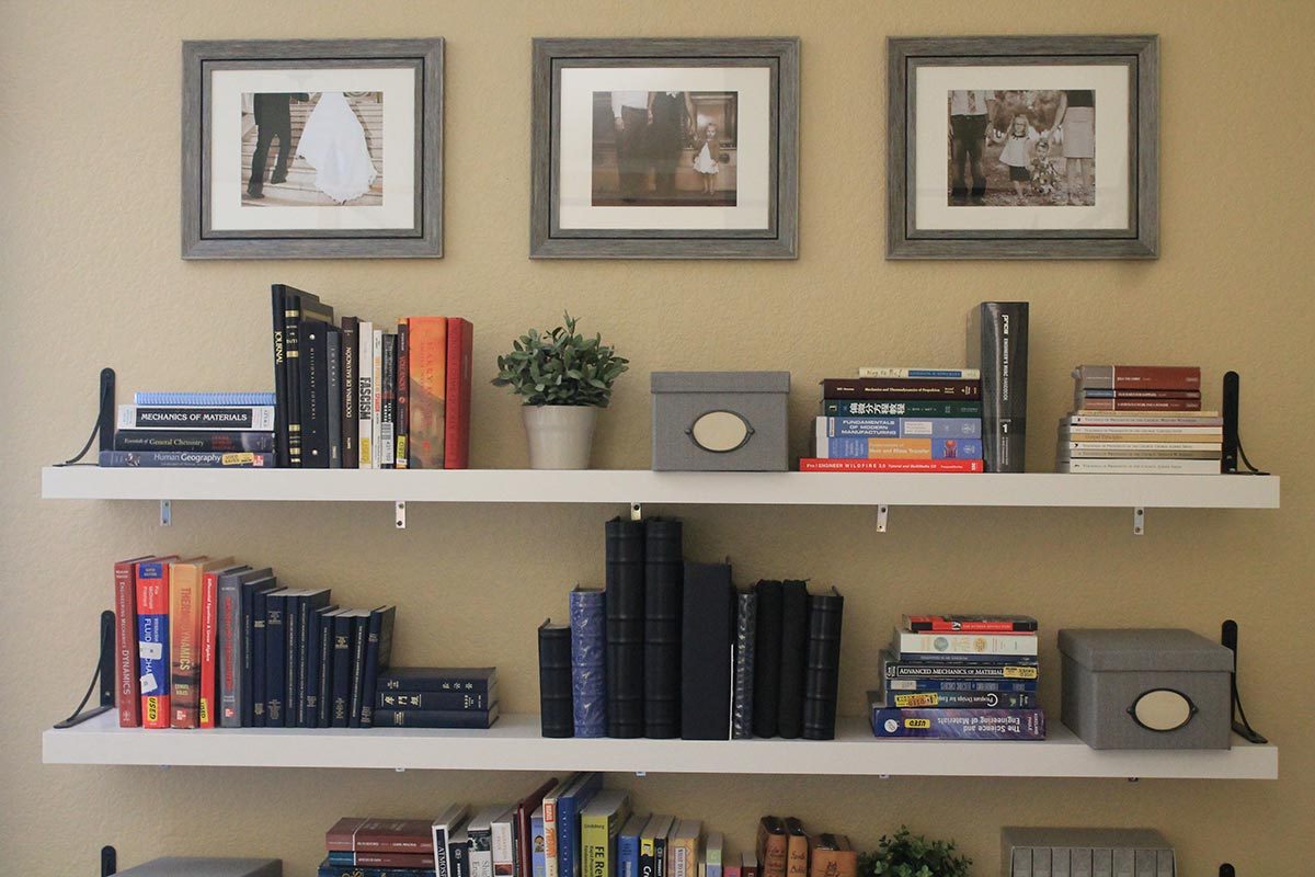 Floating shelves with books and other knick knacks on them