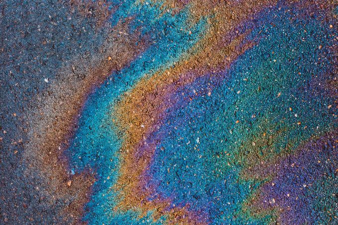 oil leaked from vehicle onto road