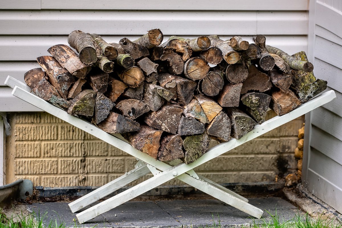firewood logs stacked outside home