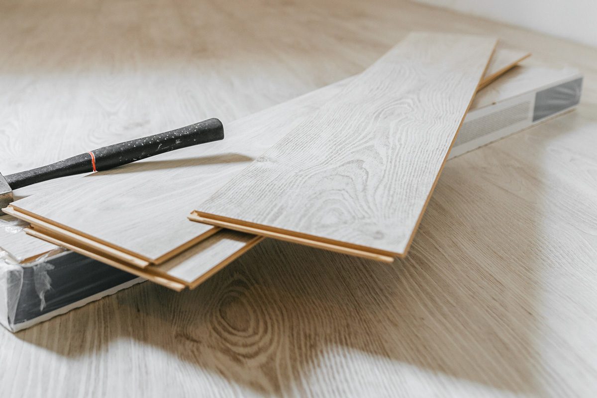sheets of wood laminate flooring in a room