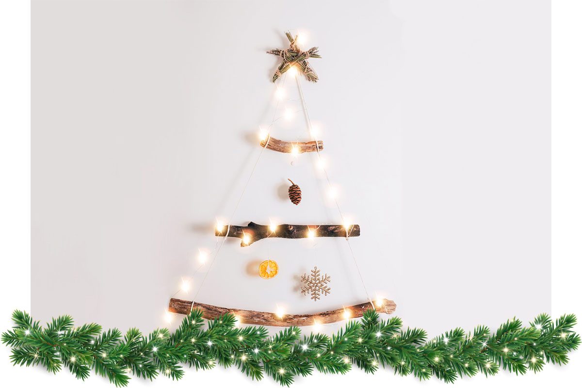 Minimalistic style Christmas tree made from dry sticks, dry orange, cones on white background.