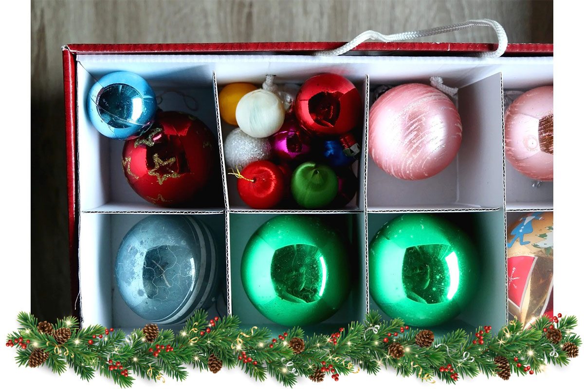 Box with organized Christmas ornaments. Top view.