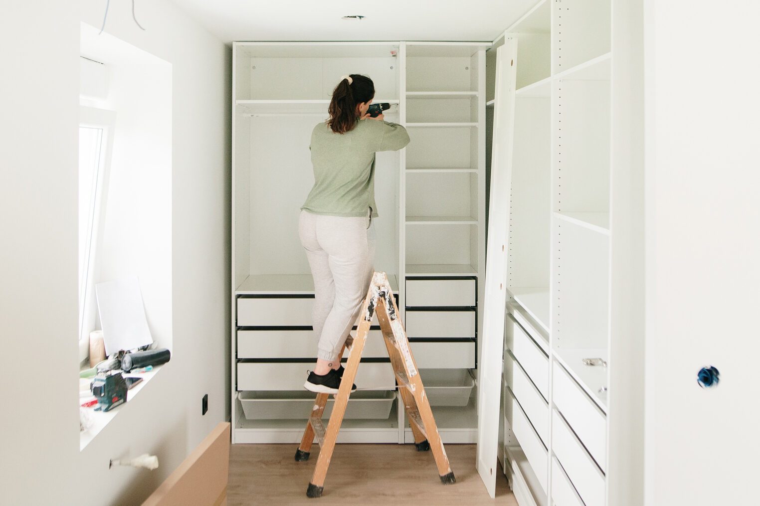 Woman assembling a closet