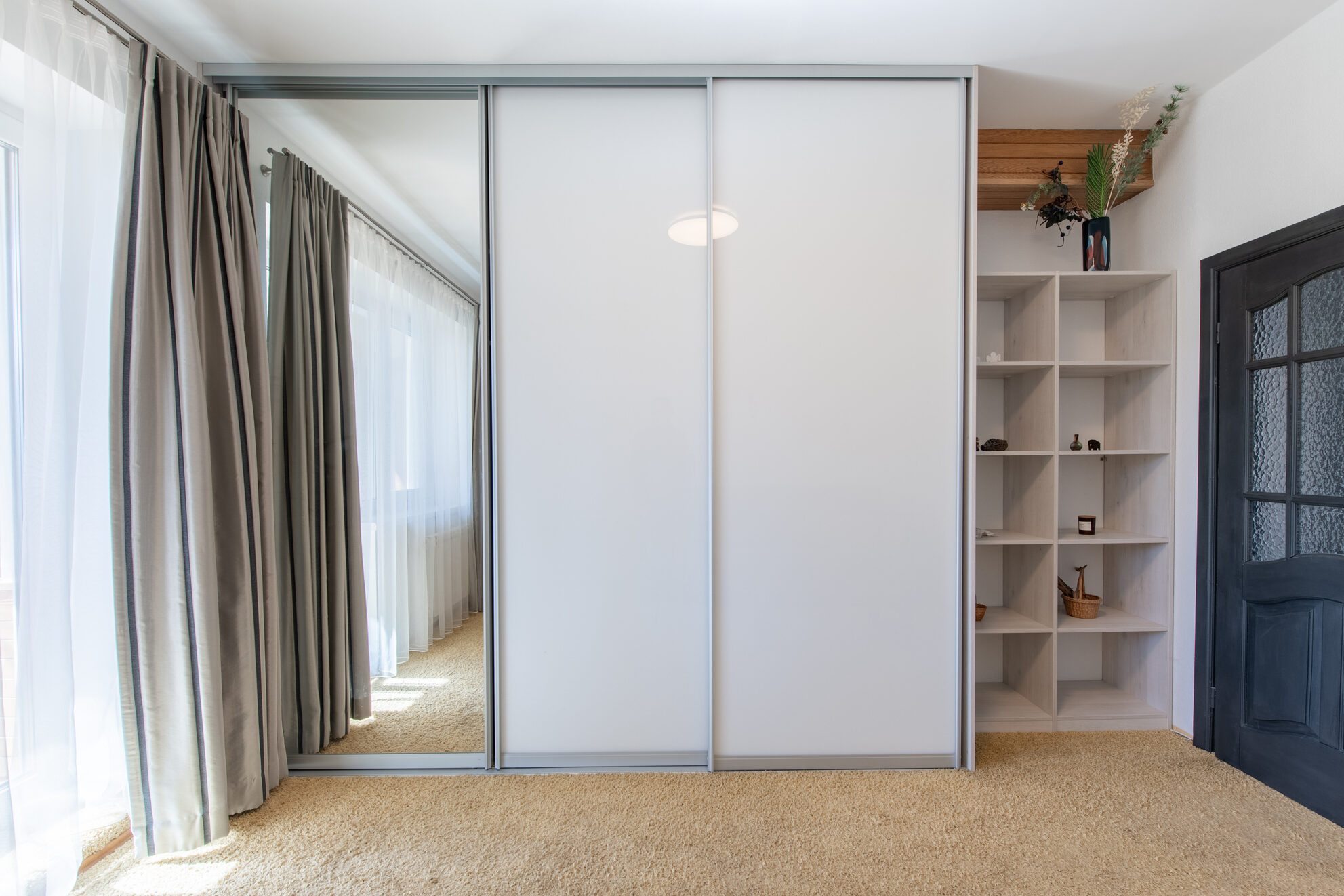 Living Room Interior. Wardrobe. Carpet. Balck Wooden Mirror Door