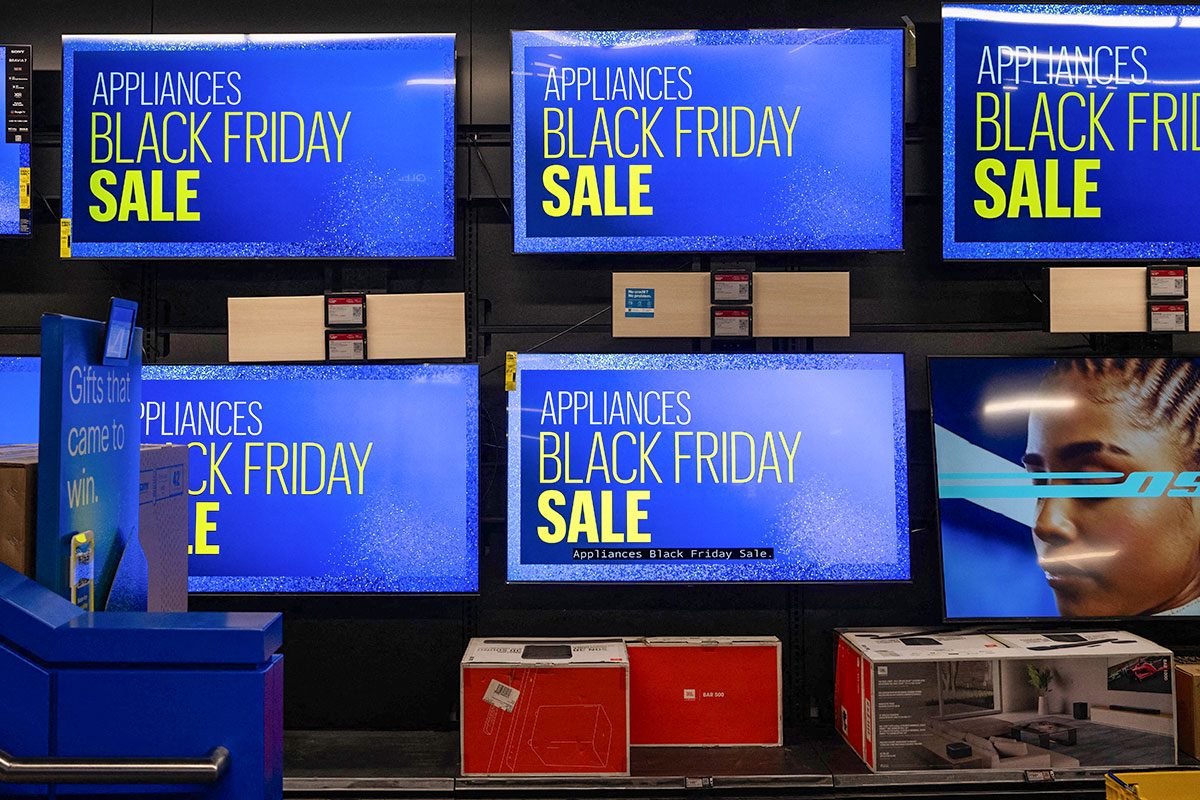Televisions display a sale message at a Best Buy store on Black Friday, in New York City