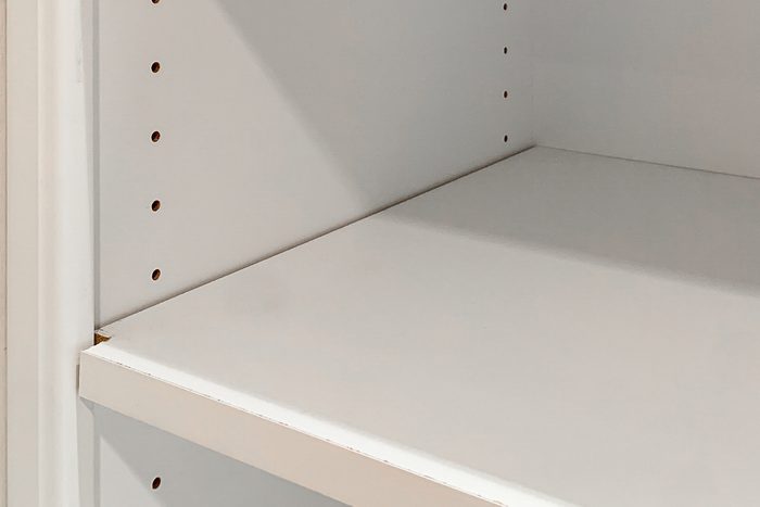 close up of adjustable shelf in a closet