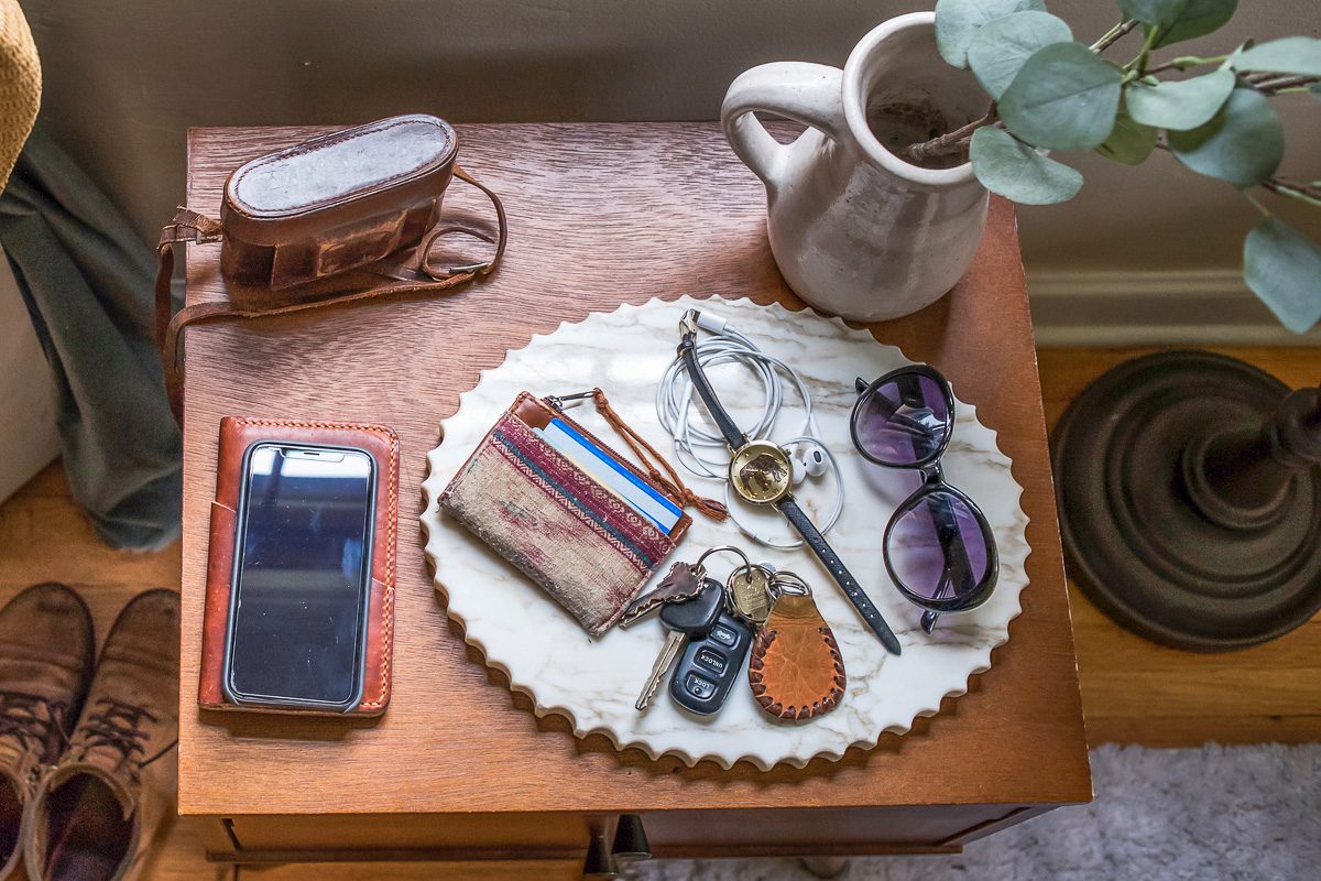 accessories in catch-all tray on table