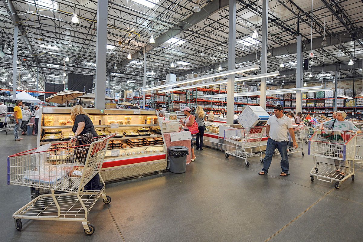 People shop at the low cost, high volume supermarket warehouse Costco