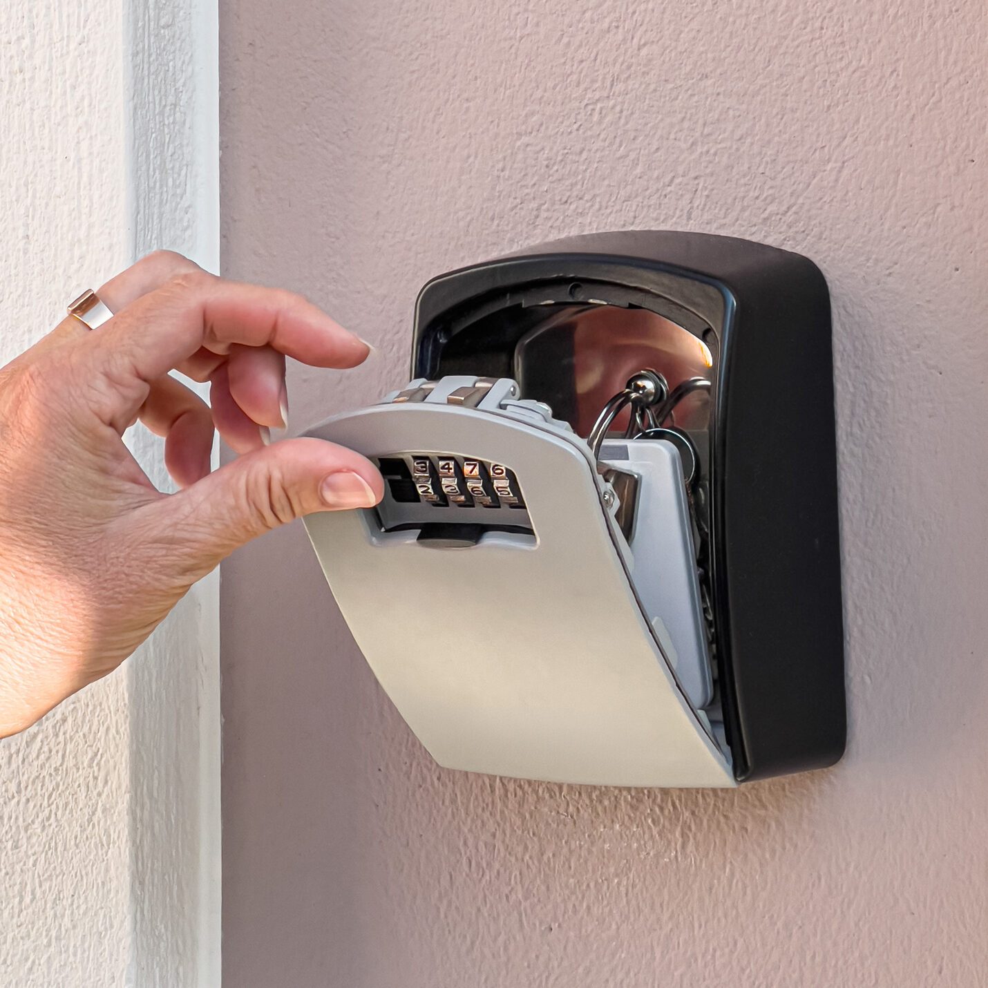 Hand opening key safe with combination lock and keys