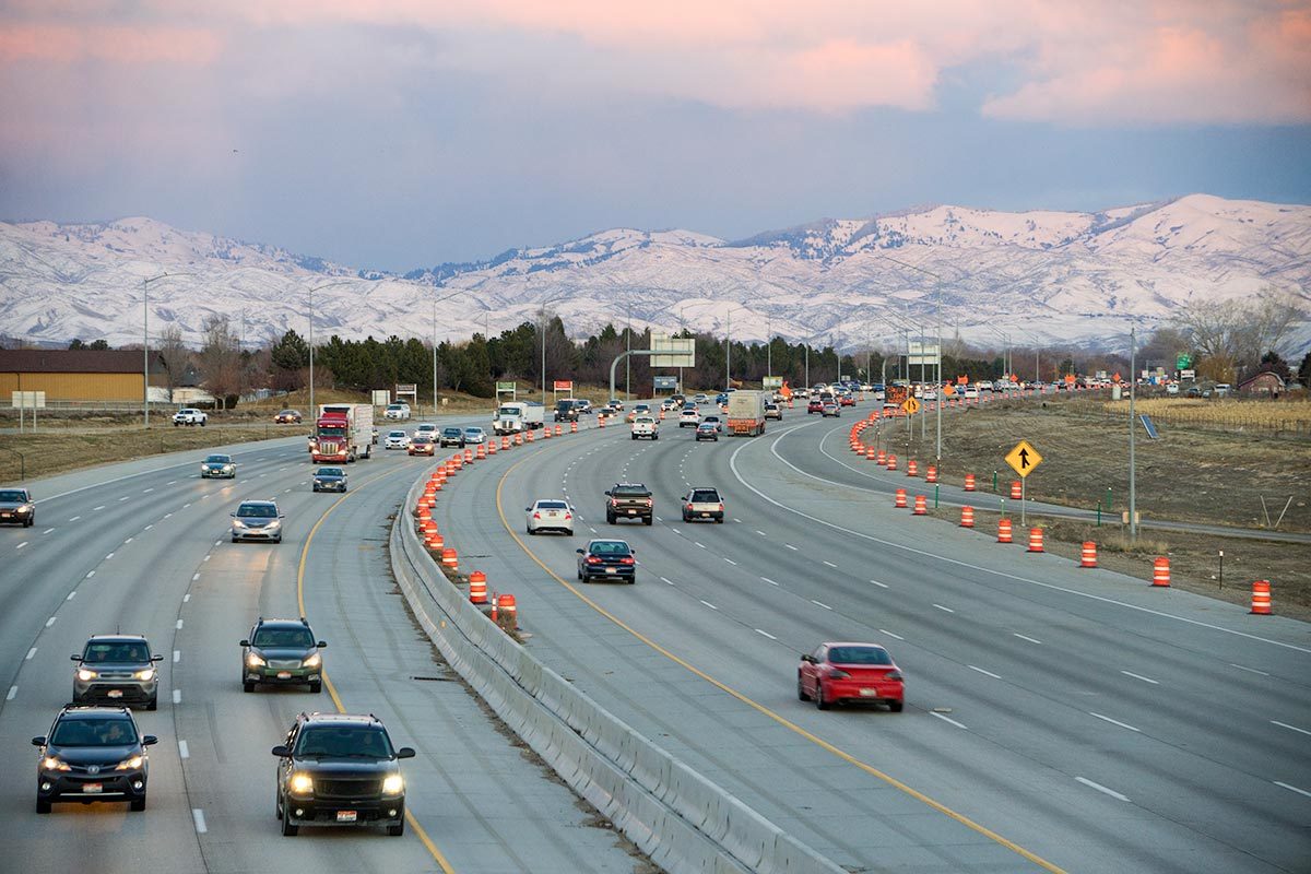 Beautiful sunset with highway and snow capped mountains in Boise, Idaho