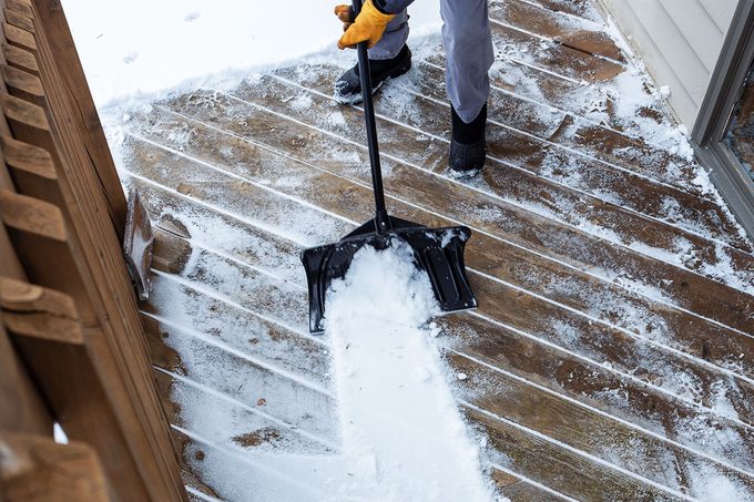 Remove Snow Without Damaging Your Deck Gettyimages 2253070633